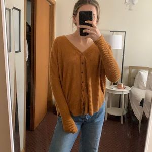Gold out from under button up sweater